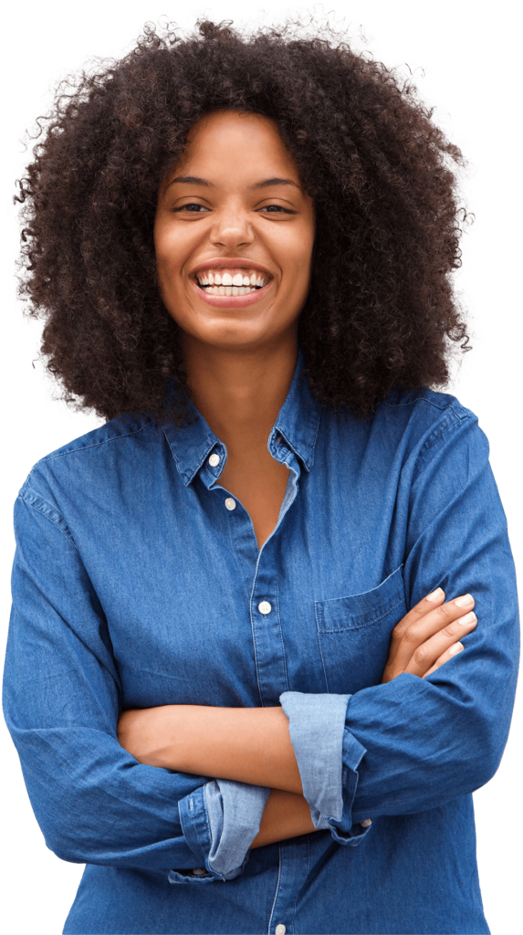 Person wearing a denim shirt, standing with crossed arms and smiling