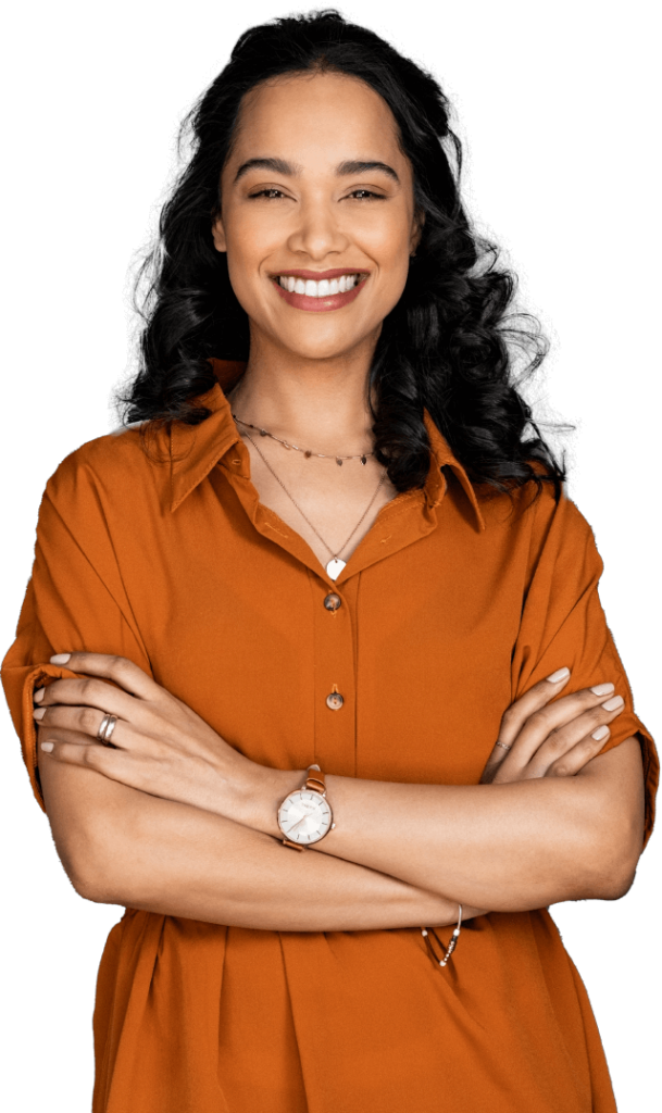 Woman in orange dress smiling with arms crossed