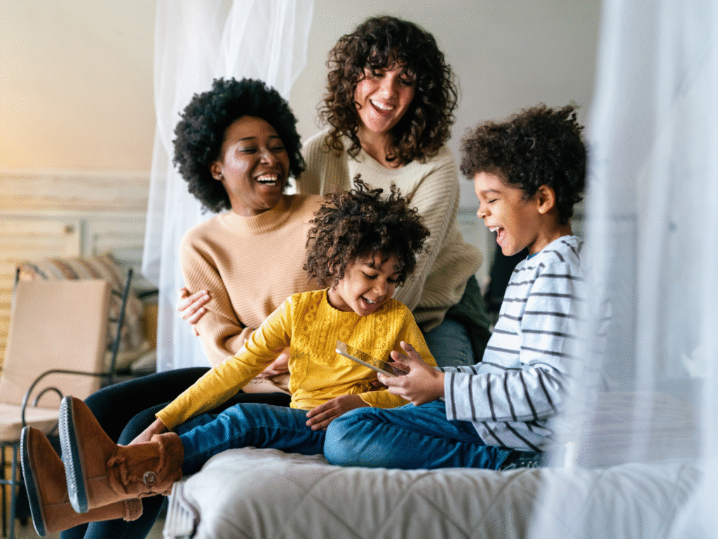 a family happily at home reviewing their insurance options on a tablet with policy from quaint oak insurance