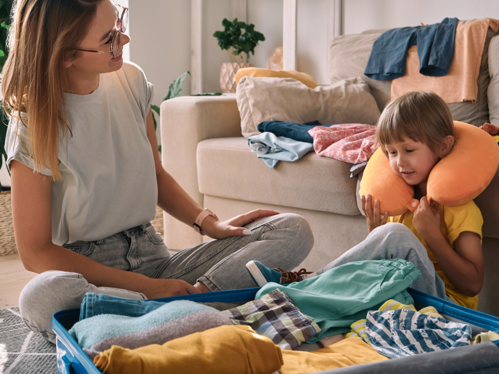 a mother and her son in their apartment packing for a trip for spring break